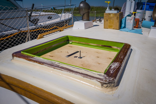 Zoom in Forward hatch removed and wooden frame epoxied to the cabin top
